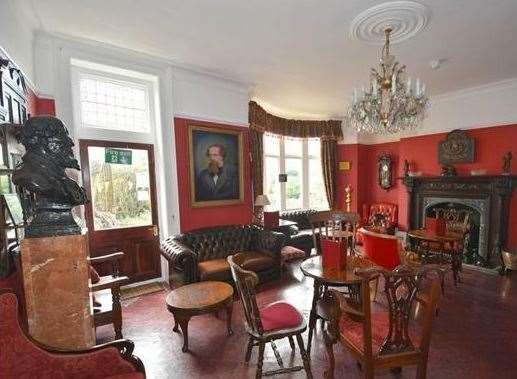 A picture of Dickens adorns the walls. Picture: Terence Painter