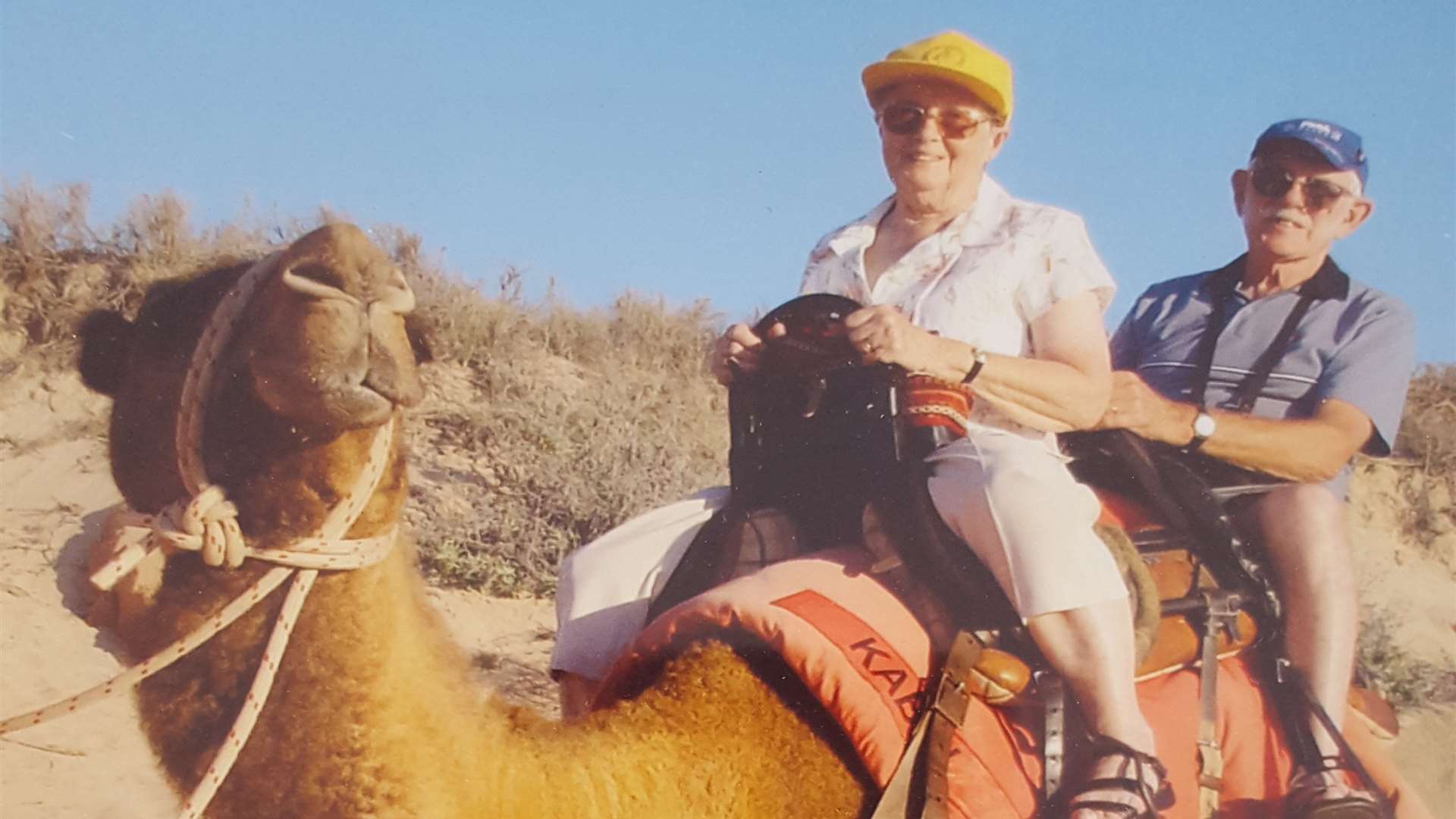 Frank and Frances King ride a camel during a trip to Australia in 2000.