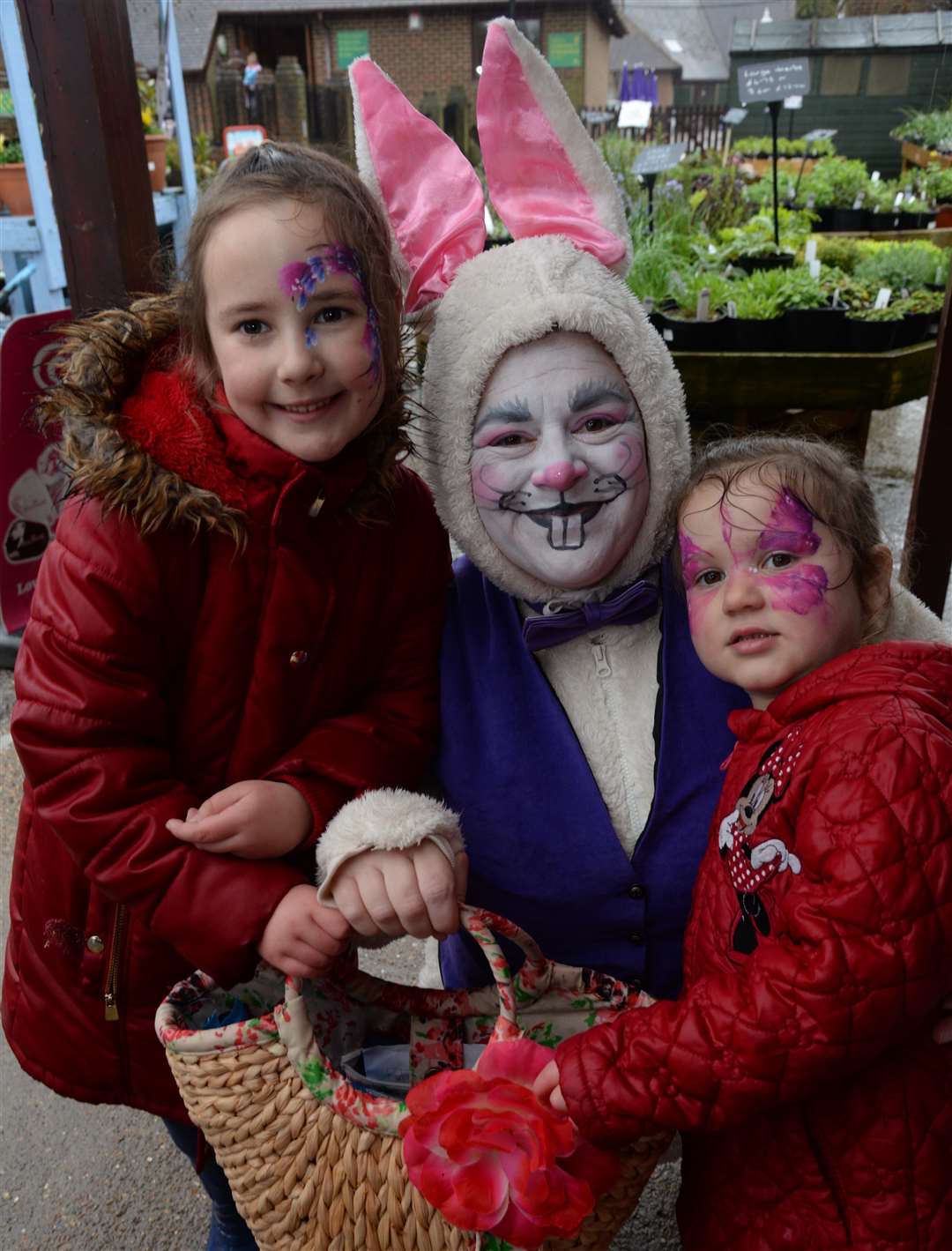 Eve and Mia Dury meet the Easter Bunny at the Rare Breeds Centre, Woodchurch last year Picture: Chris Davey