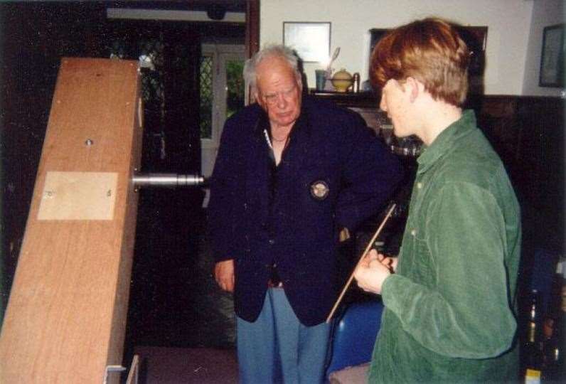 Will Marshall as a student showing the telescope he made to Sir Patrick Moore