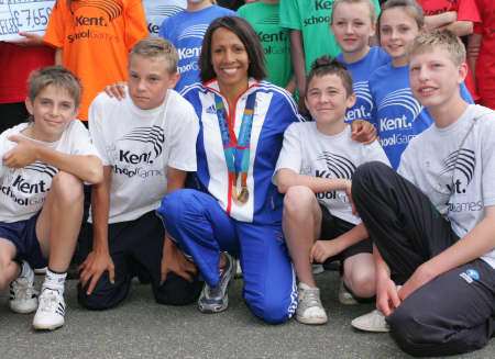 Dame Kelly Holmes with youngsters at the athletics finals of the Kent Schools Games in 2008
