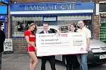Robert Handyside from Citroen with Sun girl Ruth presents a cheque for £1000 to Ramsgate Cafe owners Kevin and Sarah Davies