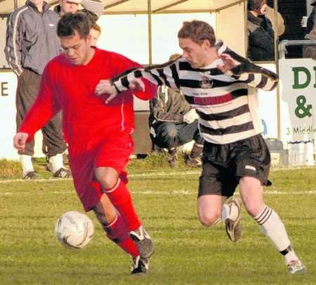 Deal's Aaron Robinson (right) puts a Norton player under pressure
