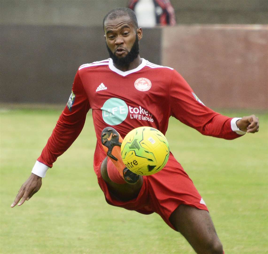 Hythe hat-trick man Zak Ansah takes the game to East Grinstead Picture: Paul Amos