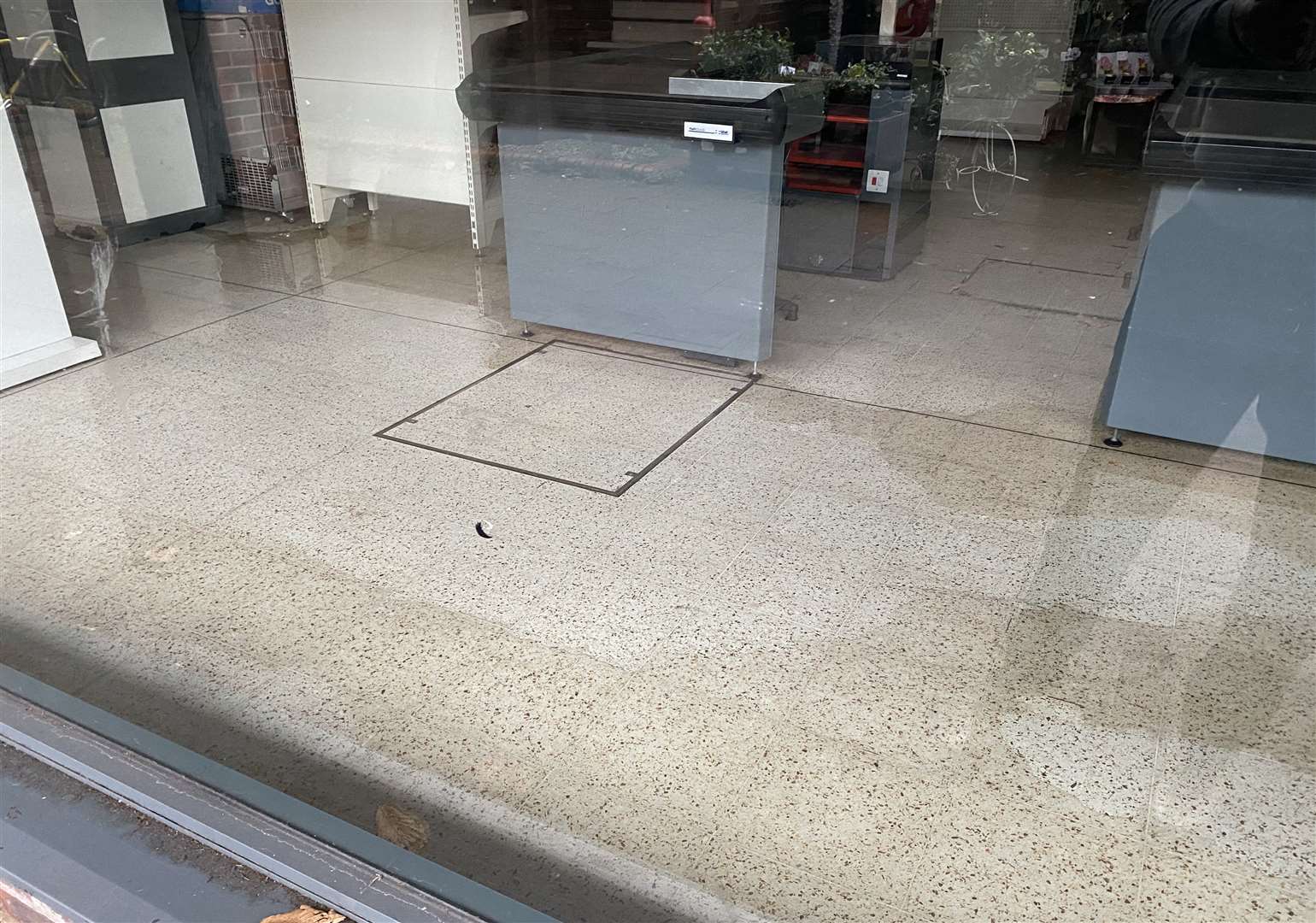 The shop floor in the Wilko covered in a puddle of water