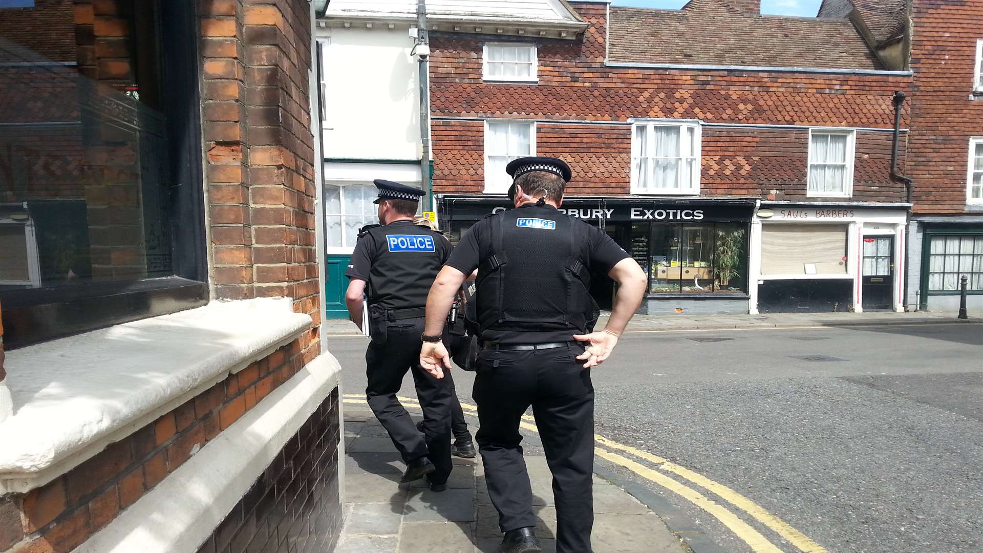 Police on the way to a raid in Canterbury