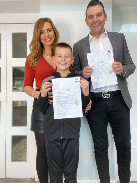 Reiss with his mum Rebecca and his step-dad Stephen