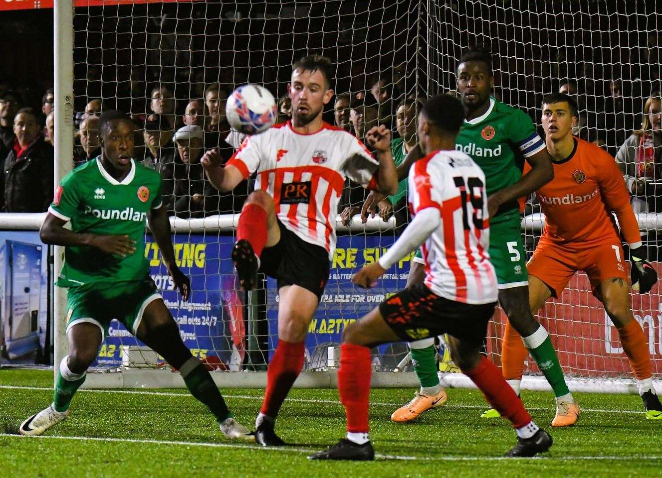 Sheppey’s Alex Willis – one of their scorers on Tuesday - in the thick of the action during Friday’s FA Cup First Round clash against League 2 Walsall at Holm Park. Picture: Marc Richards