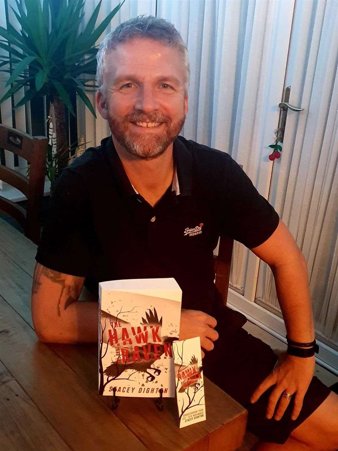 Sittingbourne author Stacey Dighton with his latest book The Hawk and The Raven