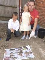 Lee Parker with his children and some of the rats caught in the area. Picture: DAVE DOWNEY