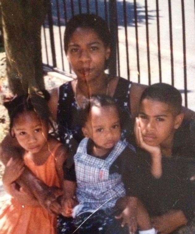 Andre Bent pictured as a child (centre) with mother Monika, sister Michaela and brother Dominic