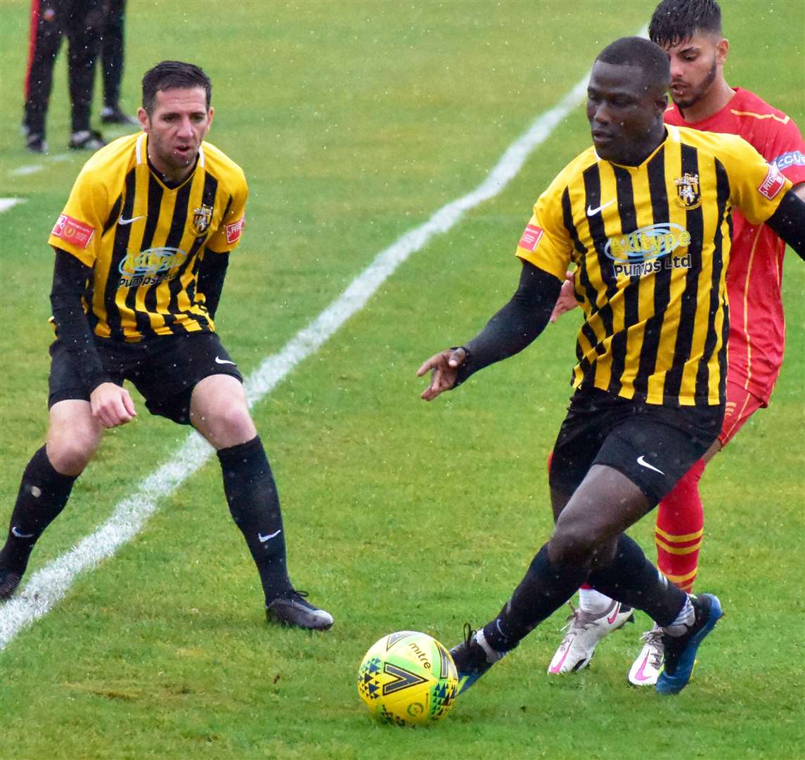 Folkestone scorer Ade Yusuff on the ball during his team's win against Gloucester City with team-mate Draycott in support. Picture: Randolph File