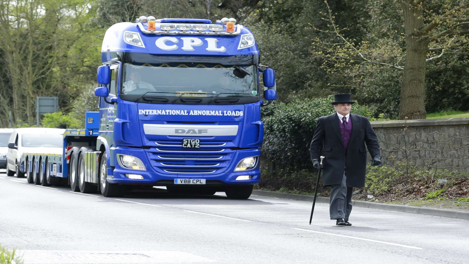 Rafael Learmonth from Angels Independent Family Funerals walks in front of the lorry. Picture: Martin Apps