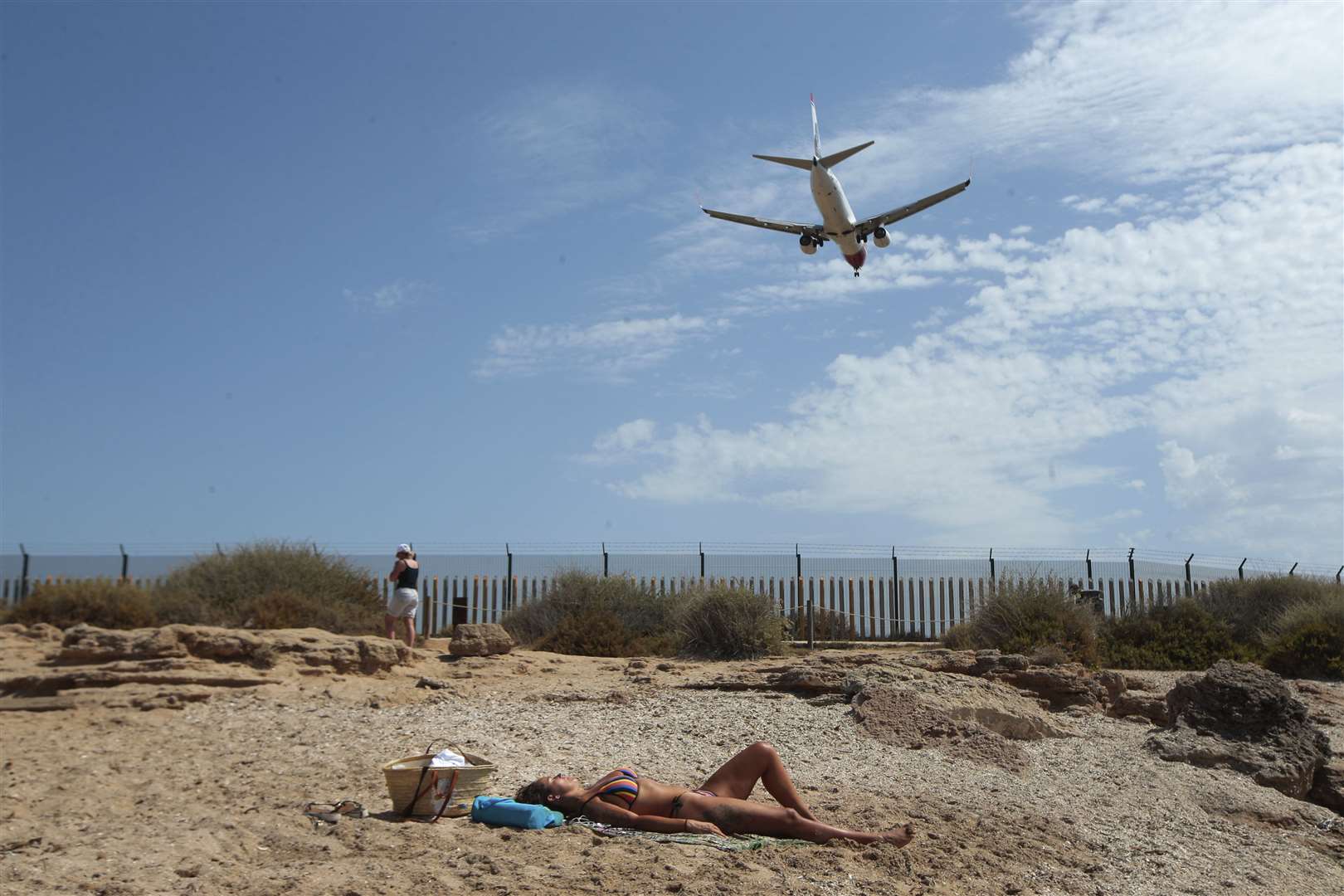 Those holidaying in Spain or its islands have to stay at home for 14 days afterwards following a change in Government rules (Joan Mateu/AP)
