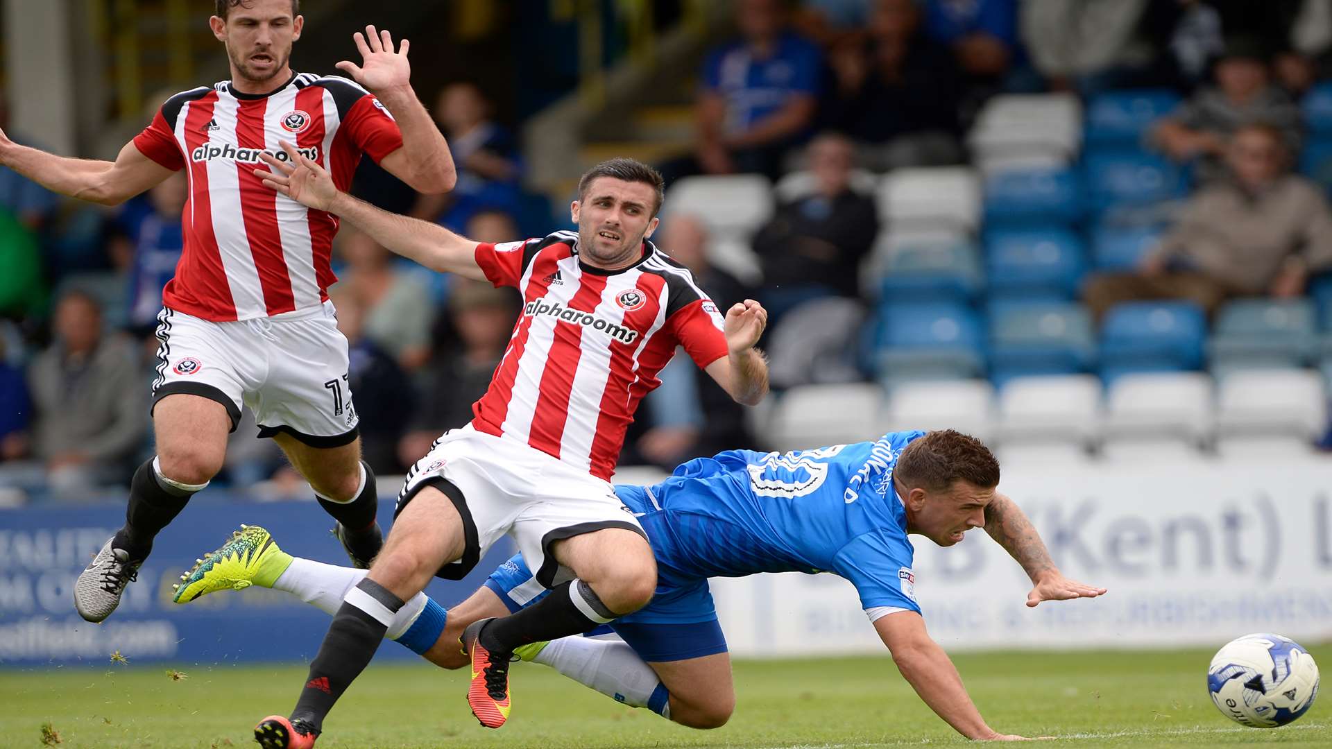McDonald sent tumbling by the Blades defence Picture: Ady Kerry