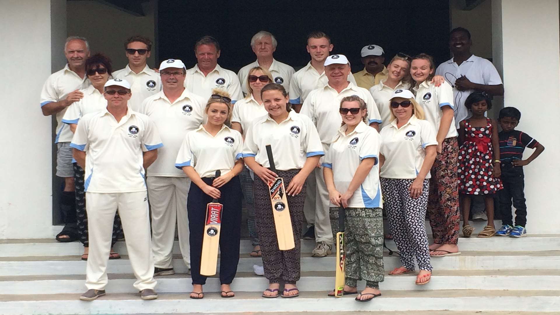 Team England about to play cricket with Harriet Booth (centre) and dad Nick Booth (back row, third left)