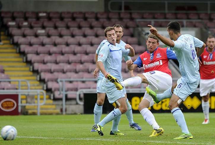 Cody McDonald fires in the Gills equaliser against Coventry. Picture: Barry Goodwin