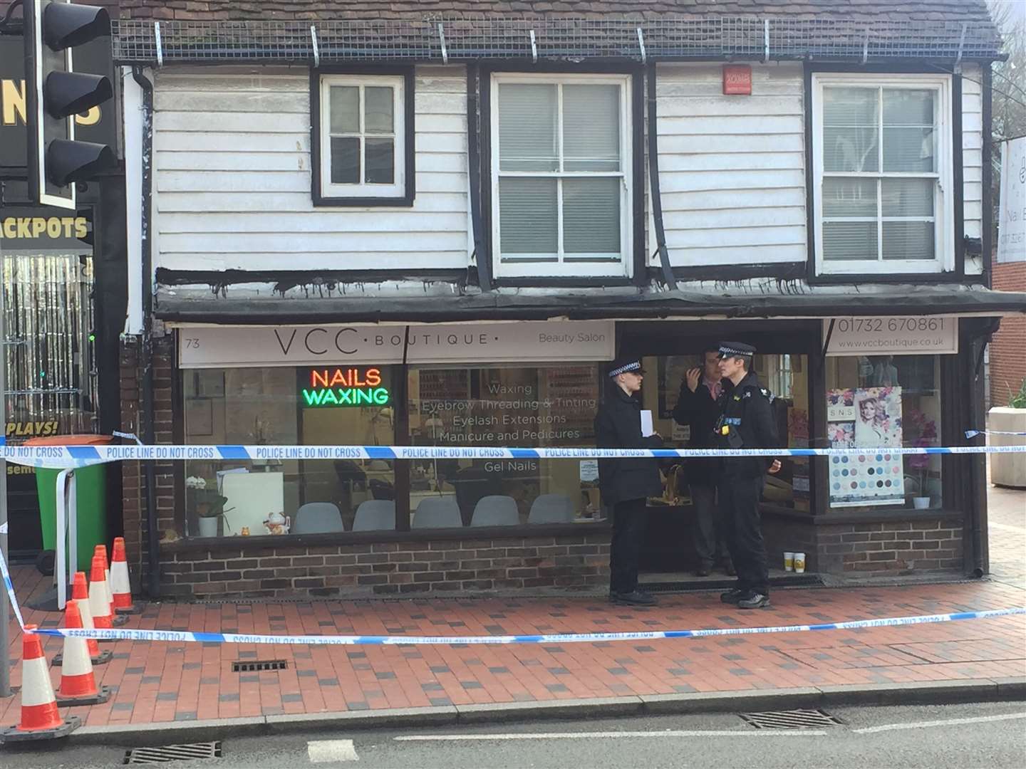 Police outside the nail bar in Tonbridge High Street
