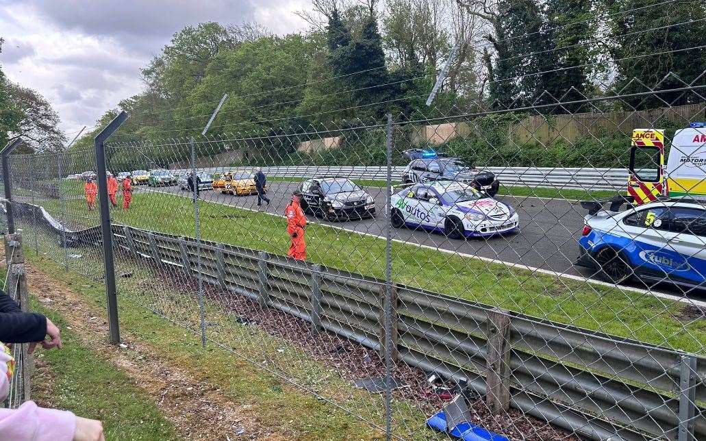 Part of the barrier was heavily damaged in the crash, and drivers were held on the circuit while rescue crews attended to the competitors involved. Picture: Joseph Petrassi