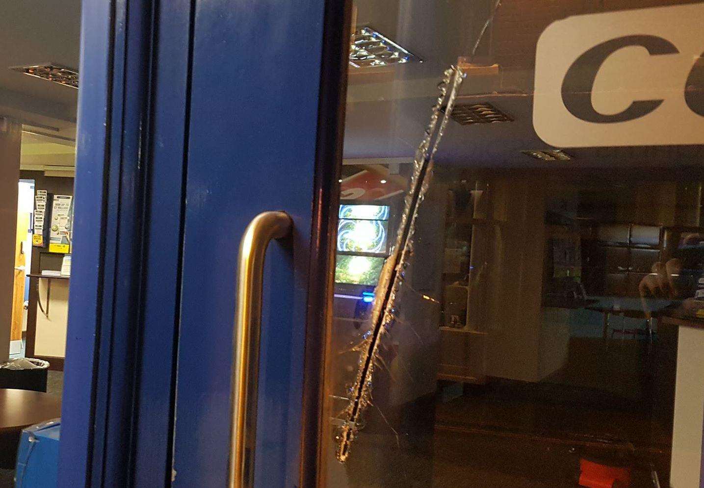 Damage caused to the window of the Coral bookmakers