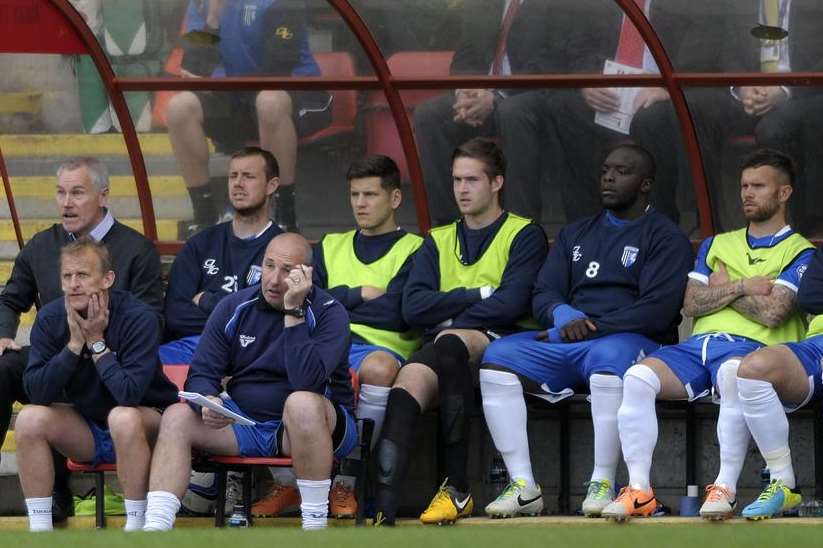 Assistant manager John Schofield (bottom left) looks on during Gills' 5-1 defeat at Orient. Picture: Barry Goodwin