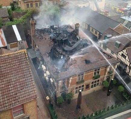 Firefighters tackling the blaze at Mu Mu in Maidstone's Week Street from above Picture: Petra Kovacsova