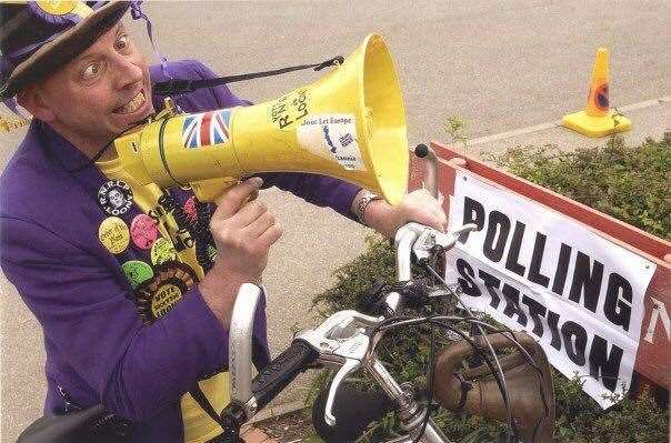 On his bike: veteran campaigner Mad Mike Young from Sheppey spreads the word for the Monster Raving Loony Party