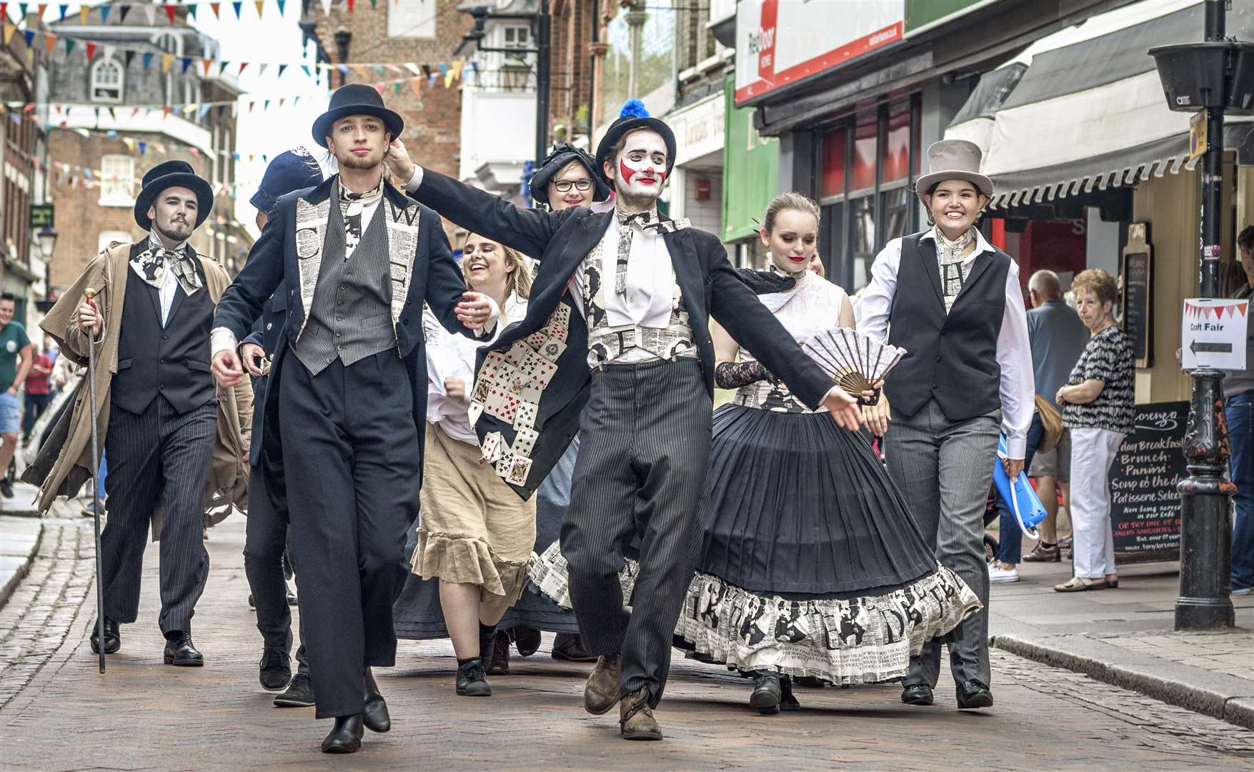 Dickensian characters parade through the streets
