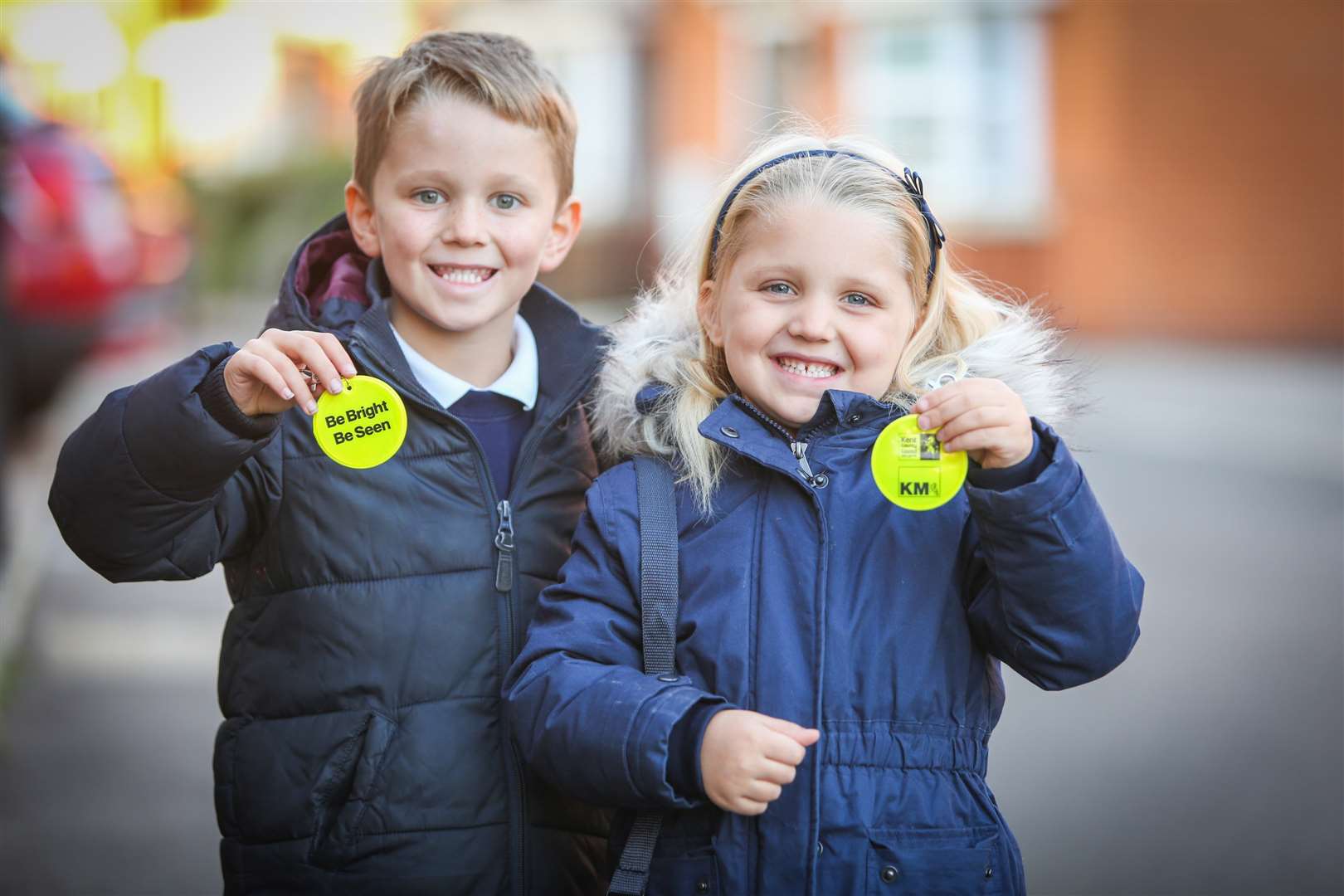 Oscar and Liv Whitlock with their Be Bright Be Seen badges