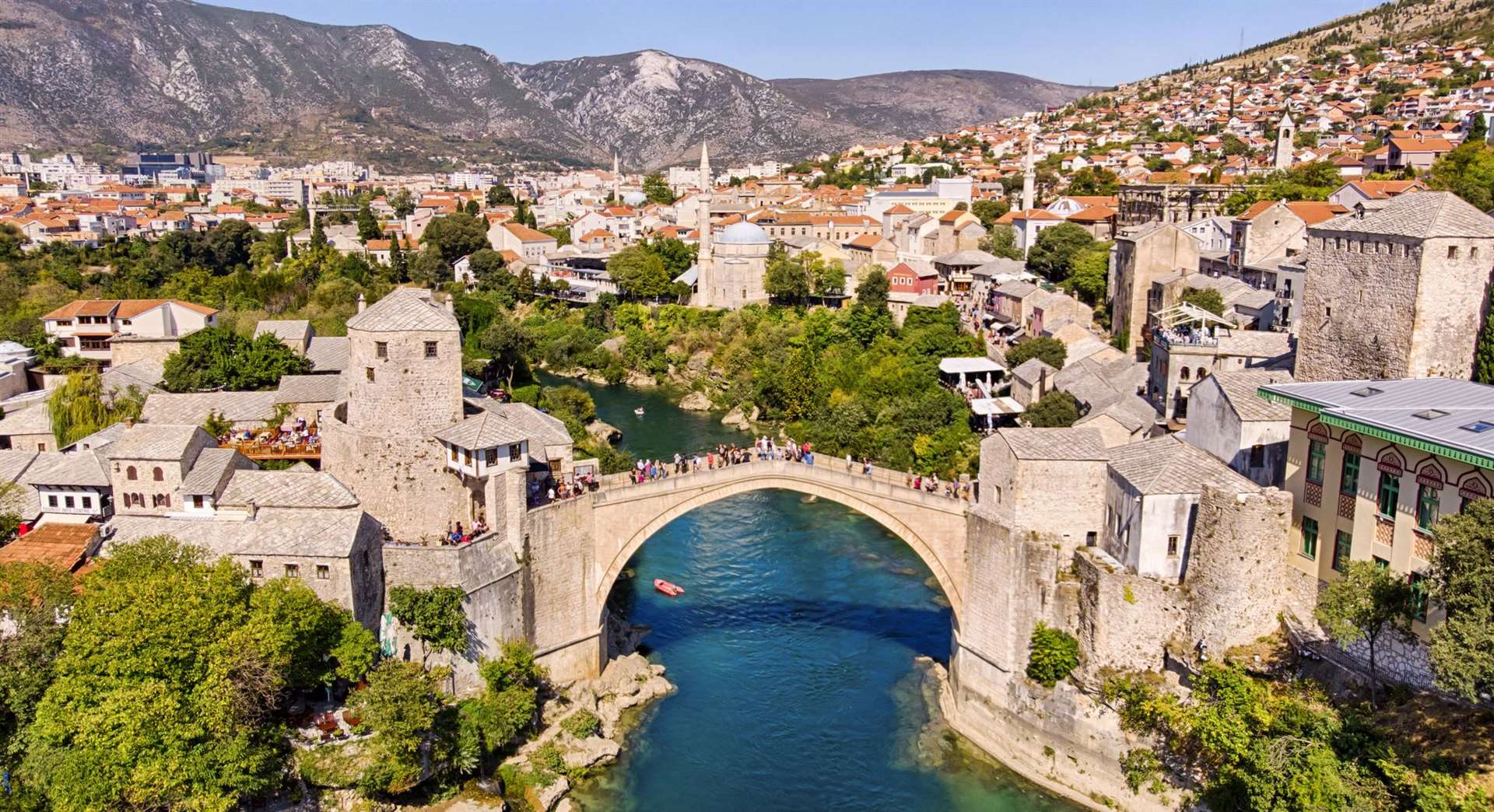 Stari Most, also known as Mostar Bridge, is a rebuilt 16th-century Ottoman bridge in the city of Mostar that crosses a river and connects the two parts of the city.