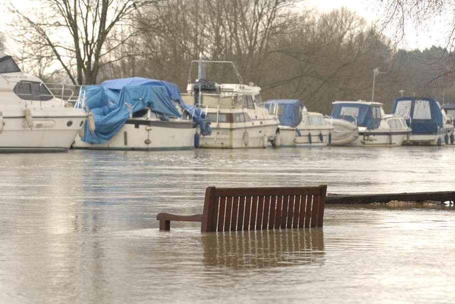 A bench is submerged in Wateringbury