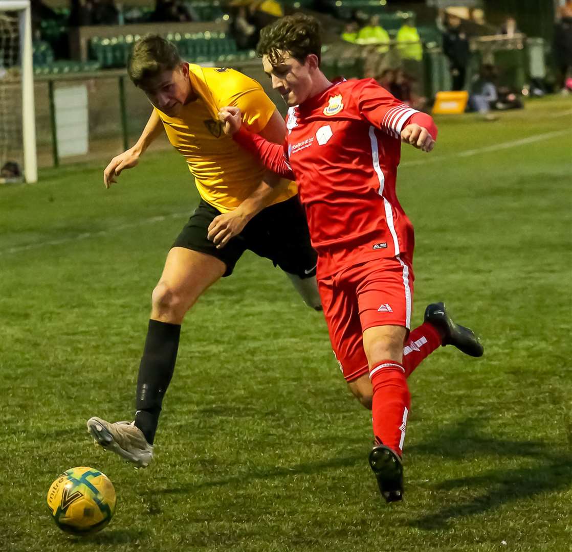 Whitstable's Gus Barnes tussles for possession. Picture: Les Biggs