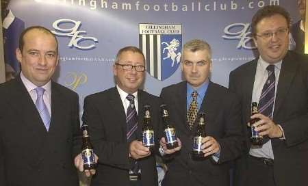 Gills chairman Paul Scally (centre left) and financial director Neal Carter (far right) celebrate the new deal with Courage representatives Roger Hayes and Douglas Dick. Picture: BARRY CRAYFORD