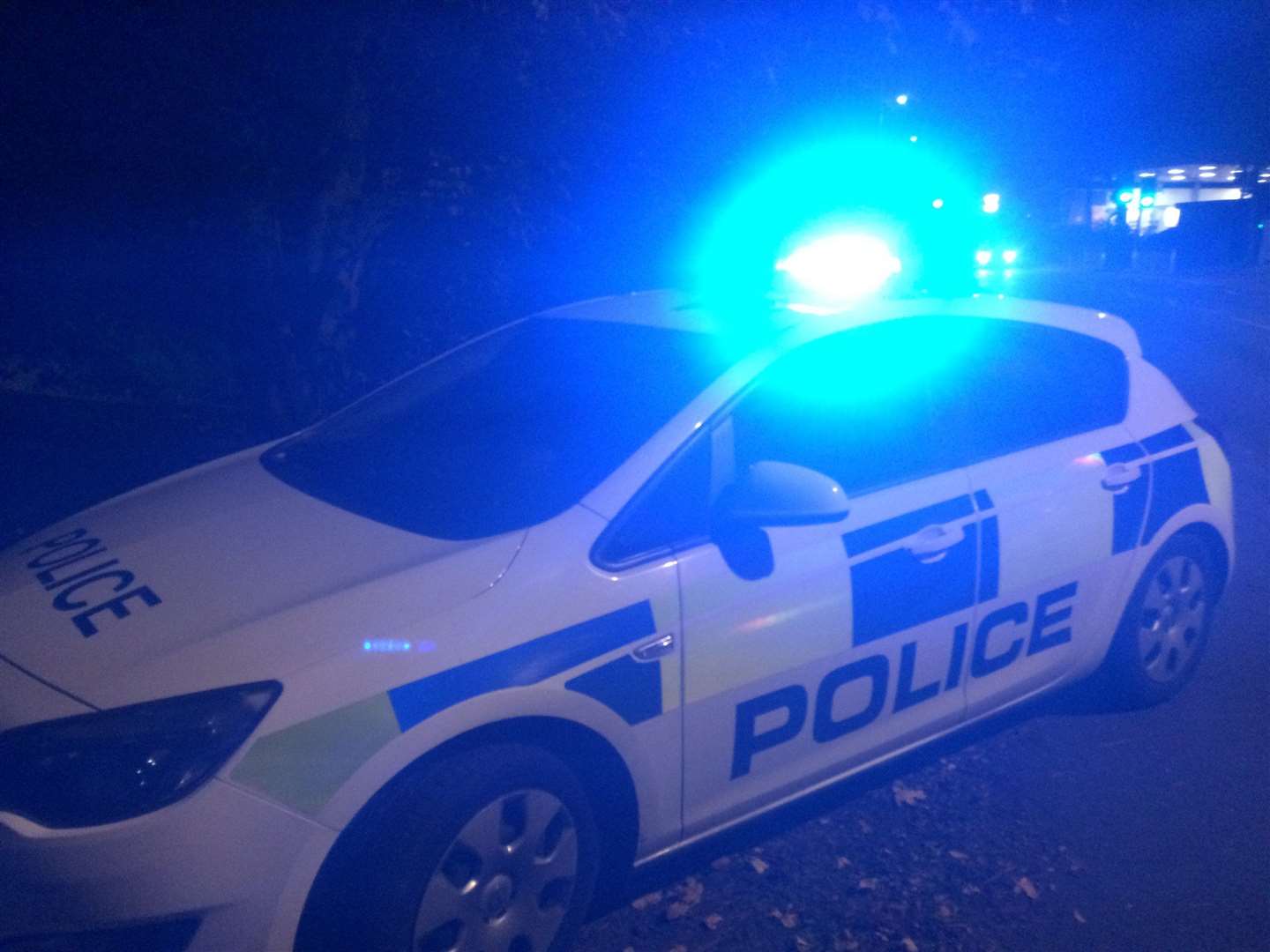 Stock image of a police car at night