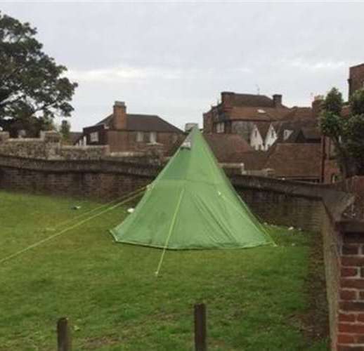 A tent pitched up in the castle moat at Rochester