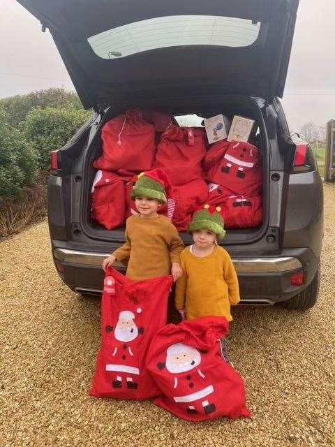 Upchurch Support Network led by mum-of-two Cia Merrall has donated 60 Christmas stockings to families with help from her two sons, Ted, four, and Kit, two, (pictured) and volunteer Amy Fernando