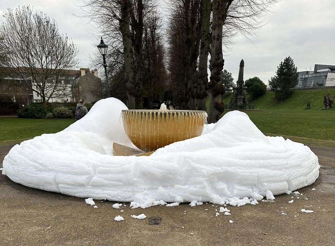 The fountain in Dane John Gardens in Canterbury has been turned into a giant bubble bath. Picture: Lola Hopkins