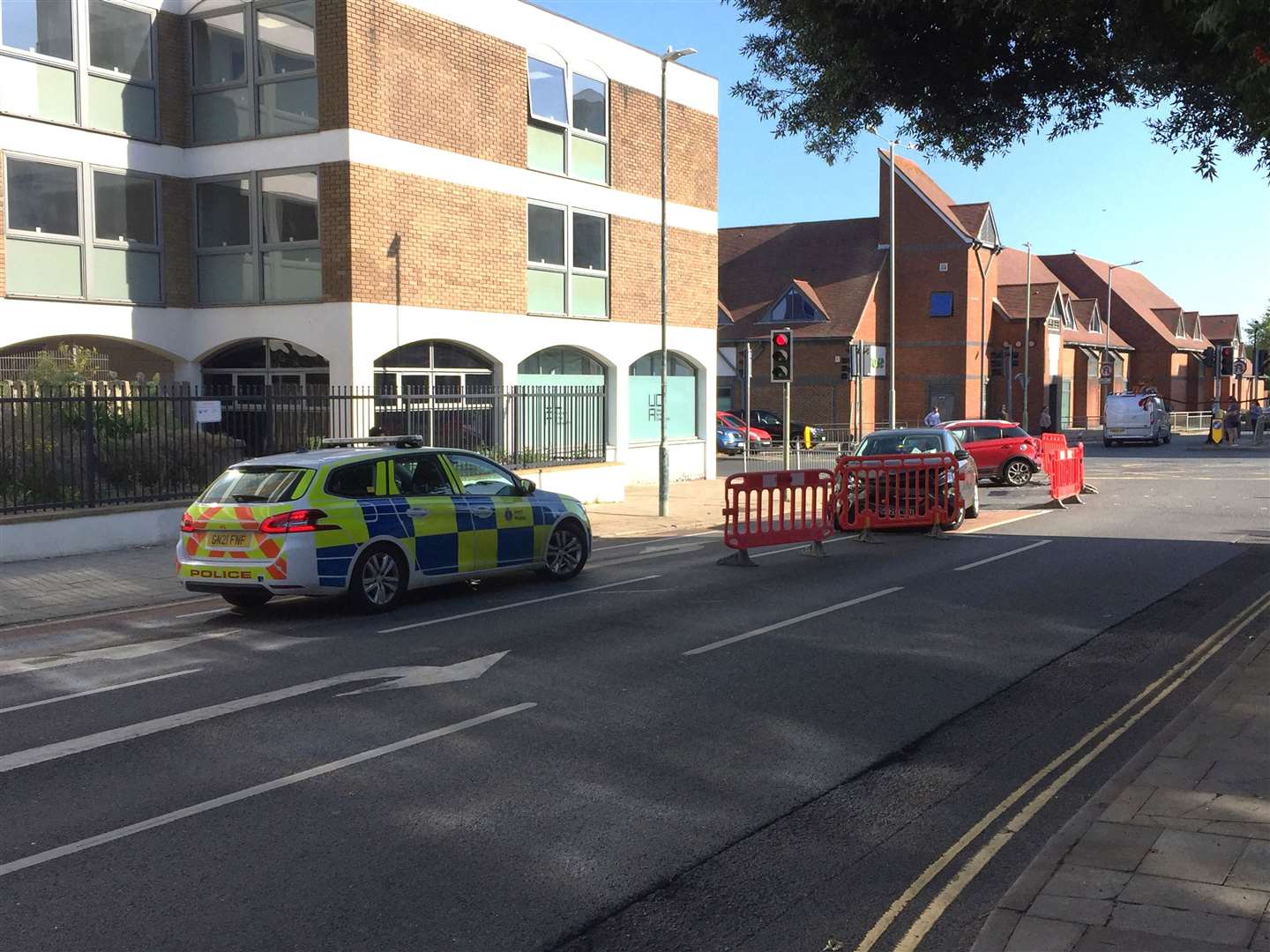 Police are at the scene of a crash involving two cars in Upper Chantry Lane, Canterbury, near the traffic lights by Waitrose and Premier Inn in New Dover Road
