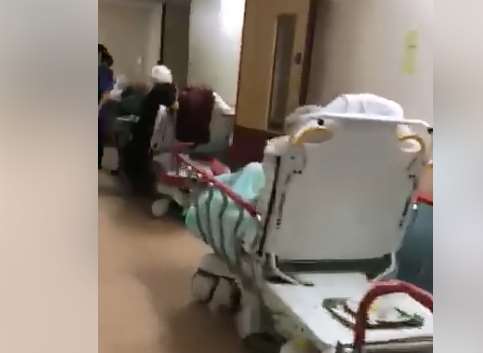 Footage shows patients stuck in beds in the hospital corridors.