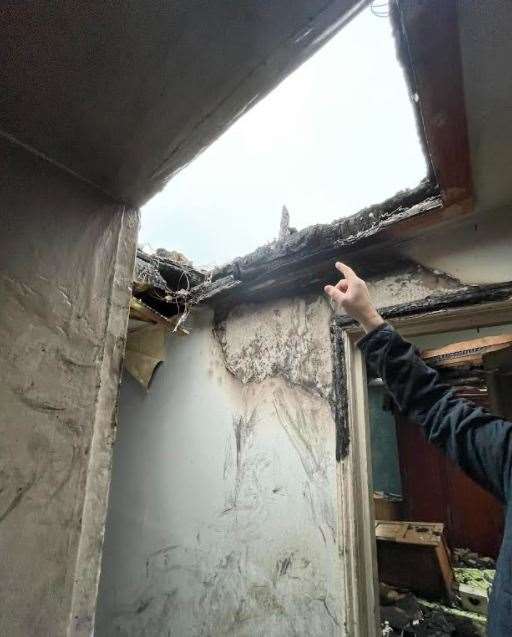 A massive hole in the roof from the fire. Picture: Zoey Cross