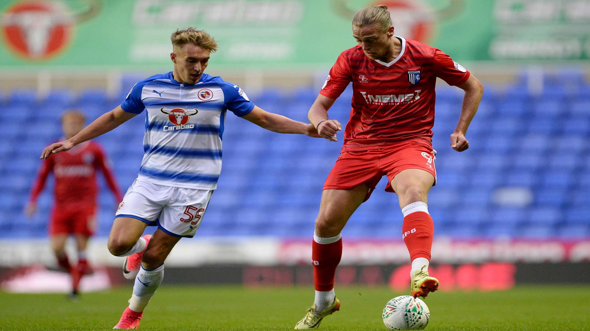 Tom Eaves on the ball as Reading's Sam Smith stays close Picture: Ady Kerry