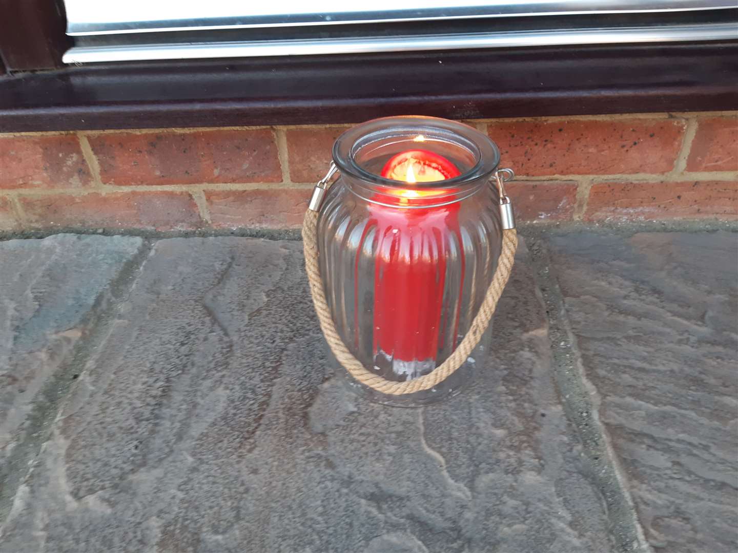 A candle left on a doorstep in Aylesham