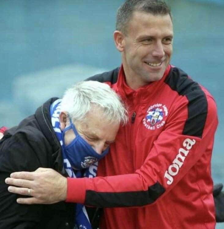 Tonbridge Angels manager Steve McKimm embraces club chairman Dave Netherstreet. Picture: David Couldridge