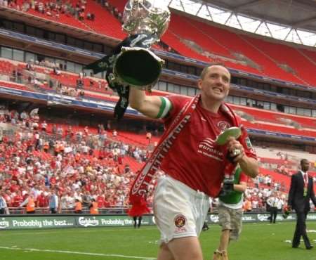 Ebbsfleet captain Paul McCarthy does a Wembley lap of honour with the FA Trophy. Picture: Barry Goodwin