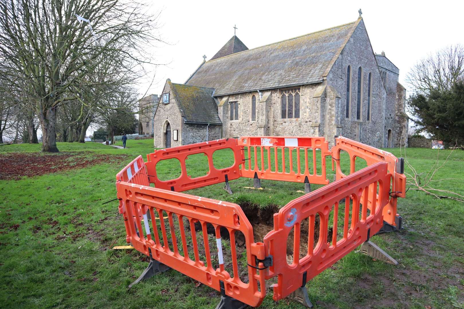 A gaping hole has appeared in the graveyard of Minster Abbey on Sheppey. Could it be a long lost tunnel or an old tomb?
