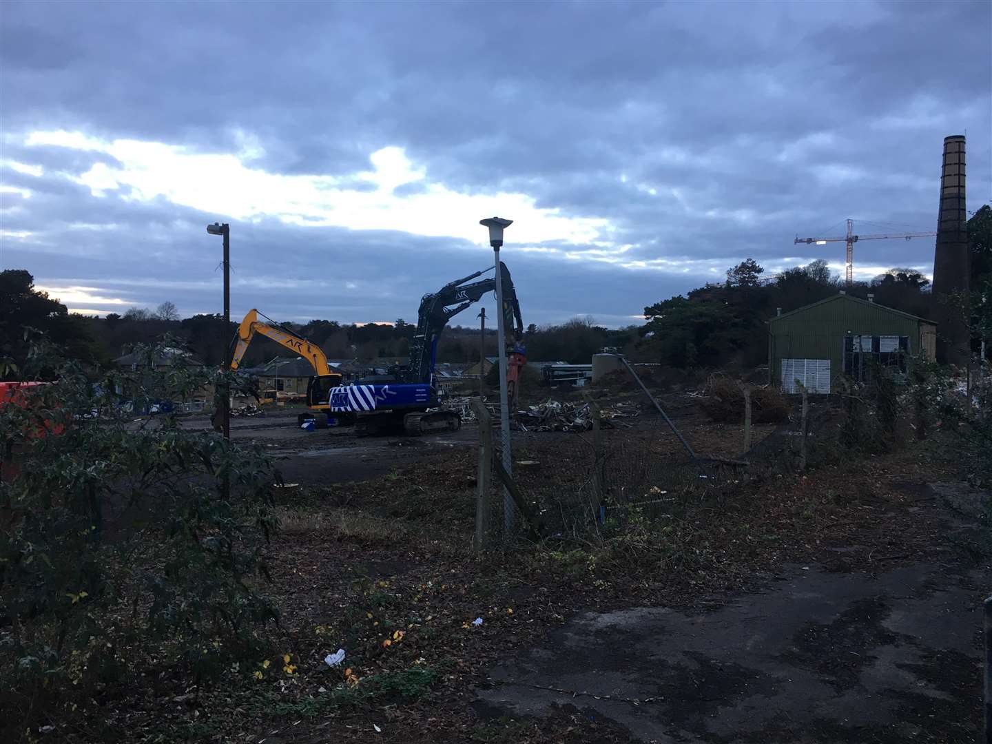 Demolition is underway at Springfield Mill, off Royal Engineers Road, Maidstone, but its chimney (right) will remain