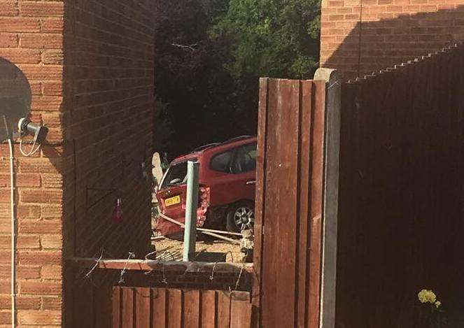 The car ending up ploughing thought a neighbour's fence, picture Logan Enfield
