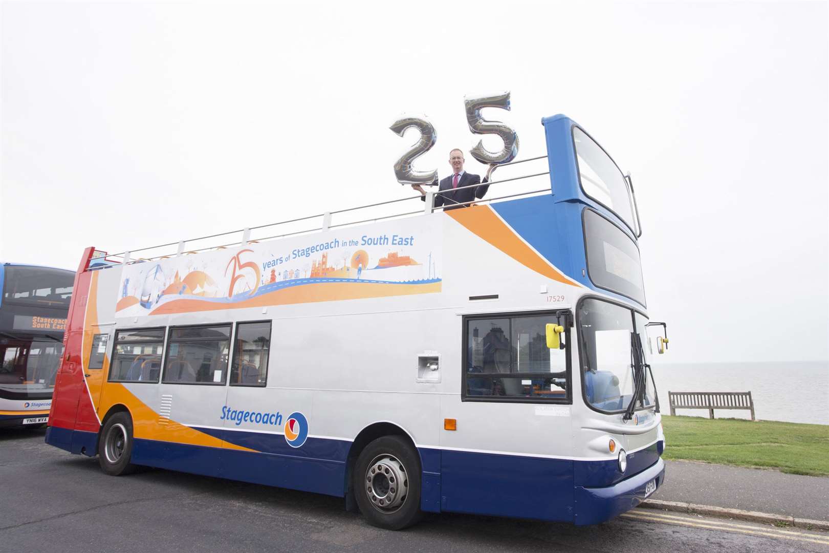 Matthew Arnold, commercial director at Stagecoach South East, celebrating the company’s 25th anniversary with the silver liveried buses (4053561)