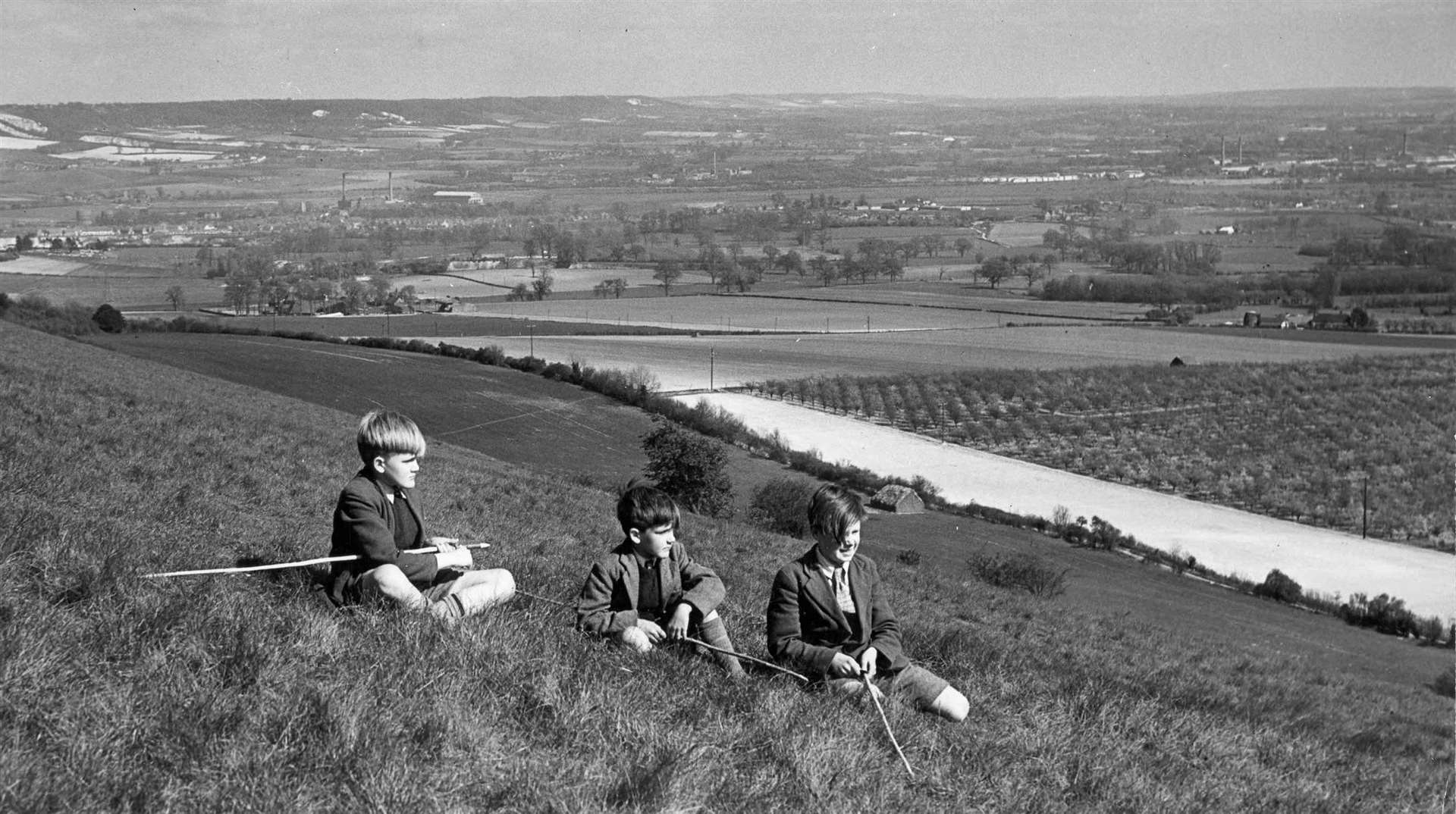 A charming view of the Medway Valley in 1954 - boys at play still wore jackets and ties