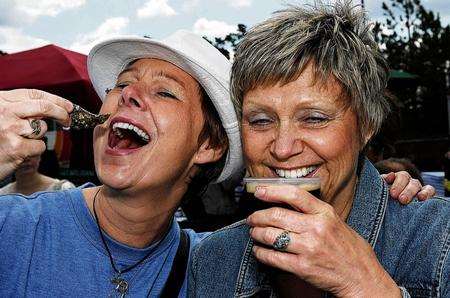 From left: Vanessa Wade and Carol Allan taste the oysters and beer. Whitstable Oyster Festival 2001. Picture: Barry Goodwin